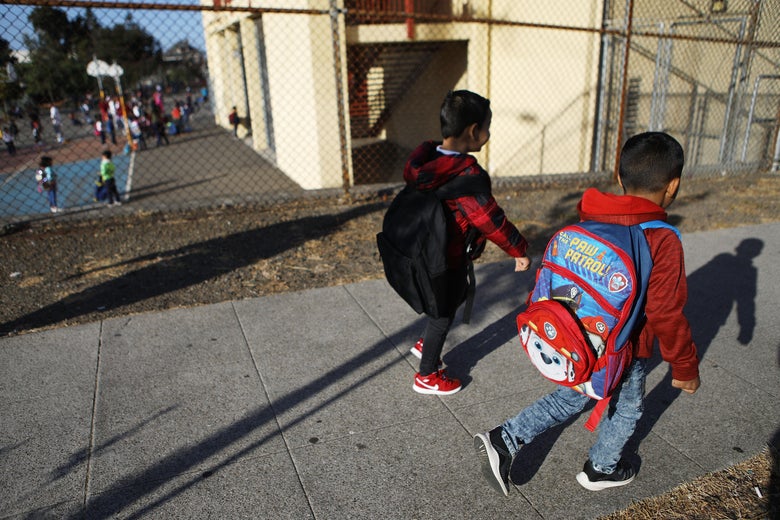 Honduran six-year-old Anthony walks to school on September 10, 2018 in Oakland, California. He and his father Juan fled their country, leaving many family members behind, and crossed the U.S. border in April at a lawful port of entry in Brownsville, Texas seeking asylum. They were soon separated and spent the next 85 days apart in detention.